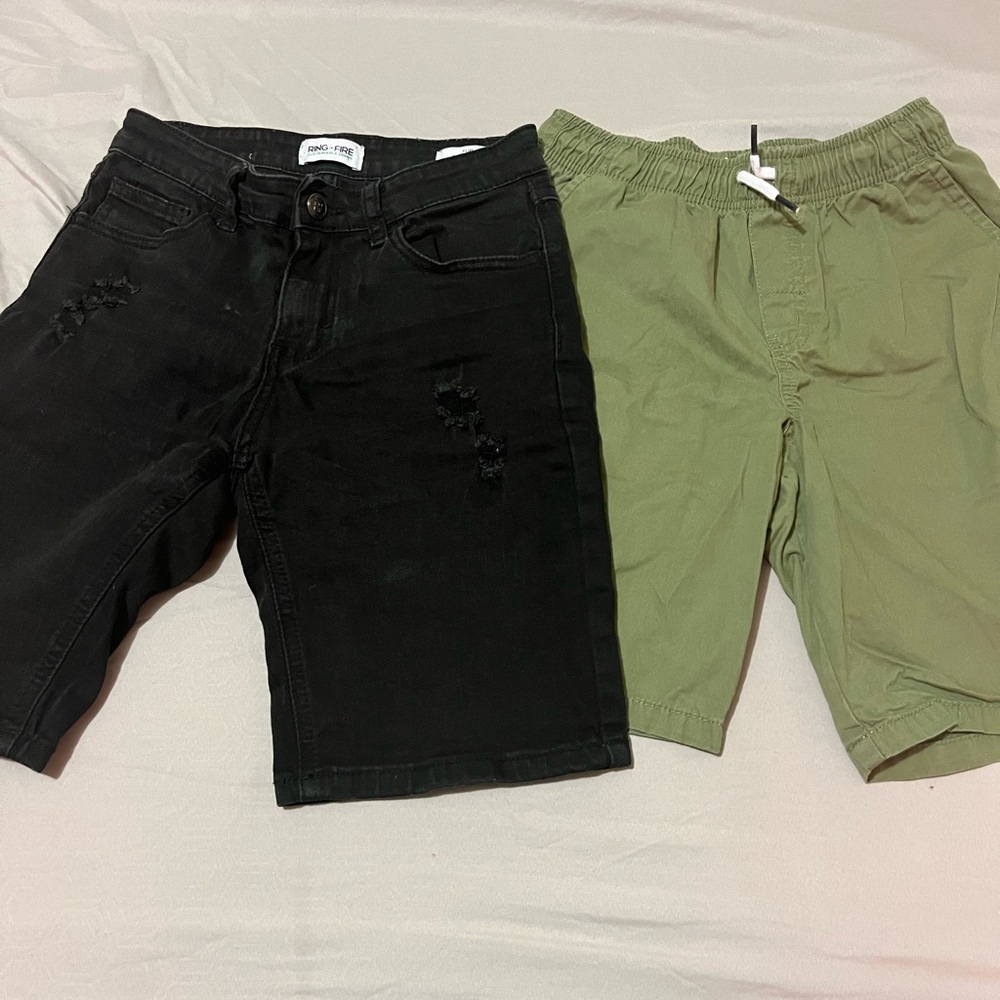 The black slim shorts for boys size 10. And the green one is size 7/8